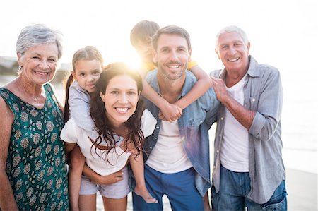elderly humorous - Cute family giving piggy back to the children on the beach Stock Photo - Premium Royalty-Free, Code: 6109-08434886