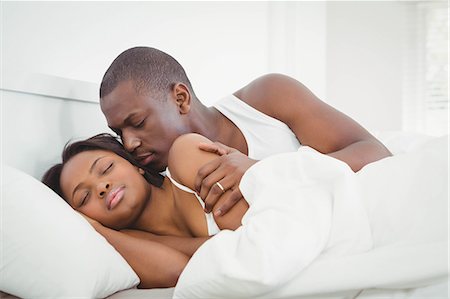 simsearch:6109-07497311,k - Ethnic couple hugging in their room Stock Photo - Premium Royalty-Free, Code: 6109-08435280