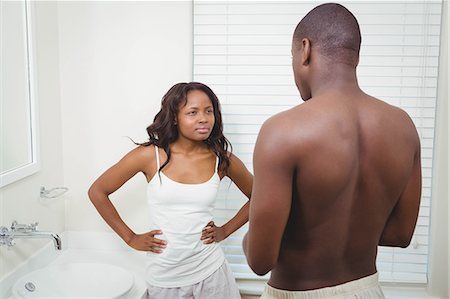 simsearch:6109-07601529,k - Ethnic couple having an argument in the bathroom Stock Photo - Premium Royalty-Free, Code: 6109-08435235