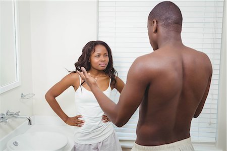 simsearch:6109-07601529,k - Ethnic couple having an argument in the bathroom Stock Photo - Premium Royalty-Free, Code: 6109-08435236