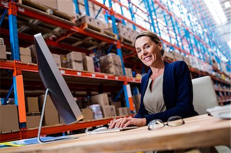 simsearch:400-04283915,k - Warehouse manager using a laptop Stock Photo - Premium Royalty-Free, Code: 6109-08581653