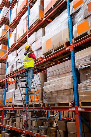 distribution - Worker on ladder in warehouse Stock Photo - Premium Royalty-Free, Code: 6109-08581678