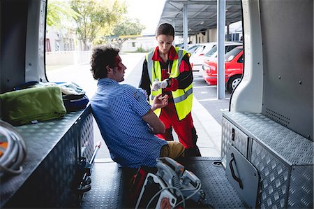 simsearch:700-00090429,k - Injured man with ambulance woman Stock Photo - Premium Royalty-Free, Code: 6109-08581841