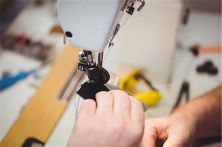 simsearch:6109-08582278,k - High angle view of hands using a sewing machine Stock Photo - Premium Royalty-Free, Code: 6109-08582197