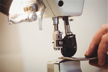 simsearch:6109-08582278,k - Close up of hands sewing a piece of leather Stock Photo - Premium Royalty-Free, Code: 6109-08582195