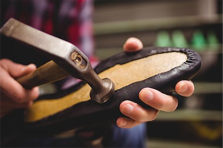 simsearch:6109-08582278,k - Close up of cobbler making shoes with a hammer Stock Photo - Premium Royalty-Free, Code: 6109-08582109