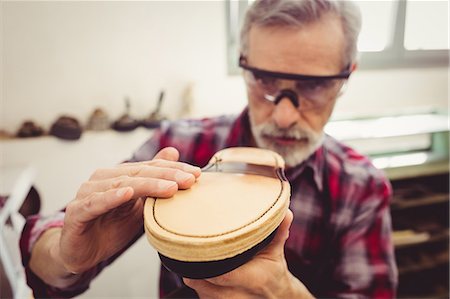 simsearch:6109-08582278,k - Cobbler touching the sole of a shoe Stock Photo - Premium Royalty-Free, Code: 6109-08582247