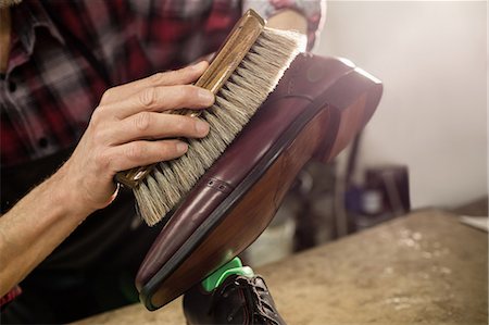 simsearch:6109-08582278,k - Close up of hand polishing a shoe Stock Photo - Premium Royalty-Free, Code: 6109-08582250