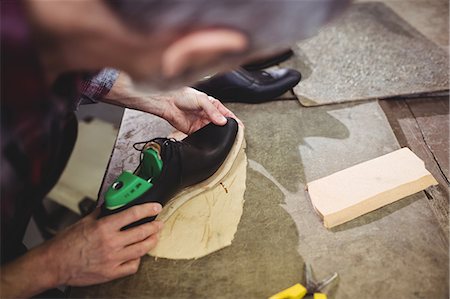 simsearch:6109-08582278,k - High angle view of cobbler making a shoe Stock Photo - Premium Royalty-Free, Code: 6109-08582263