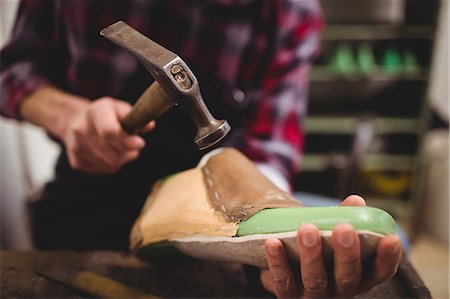 simsearch:6109-08582278,k - Close up of hand hammering on a shoe Stock Photo - Premium Royalty-Free, Code: 6109-08582279