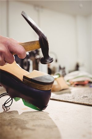 simsearch:6109-08582278,k - Close up of hand hammering on the heel of a shoe Stock Photo - Premium Royalty-Free, Code: 6109-08582223