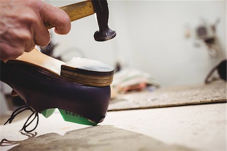 simsearch:6109-08582278,k - Close up of hand hammering on the heel of a shoe Stock Photo - Premium Royalty-Free, Code: 6109-08582221