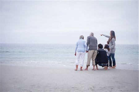 simsearch:6109-06003758,k - Family standing together and looking at sea Stock Photo - Premium Royalty-Free, Code: 6109-08536527
