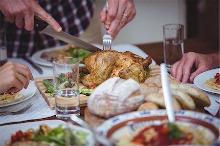 drinking water glass - Cropped image of family having food Stock Photo - Premium Royalty-Free, Code: 6109-08536666