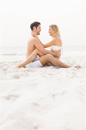 simsearch:6109-06195487,k - Happy couple sitting and embracing Stock Photo - Premium Royalty-Free, Code: 6109-08536763