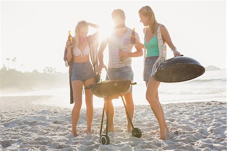 summer beach beauty - Cute group of friends having a barbecue and beers Stock Photo - Premium Royalty-Free, Code: 6109-08536839