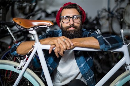 Bike mechanic checking at bicycle Stock Photo - Premium Royalty-Free, Code: 6109-08537287