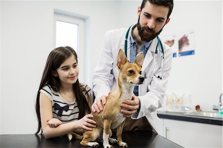 simsearch:6109-08537861,k - Vet examining dog with its owner Stock Photo - Premium Royalty-Free, Code: 6109-08537824