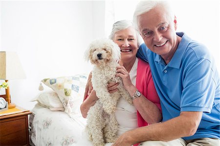 dog and woman and love - Senior couple holding a dog Stock Photo - Premium Royalty-Free, Code: 6109-08538269