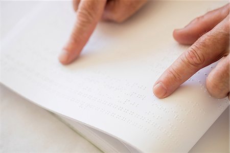 elderly assisted living - Blind senior woman using braille to read Stock Photo - Premium Royalty-Free, Code: 6109-08538365