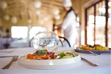 food and beverage service uniform - View of a prepared dish in a restaurant Stock Photo - Premium Royalty-Free, Code: 6109-08689757