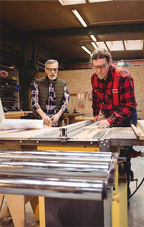 simsearch:6102-07158067,k - Duo of carpenter working in their workshop Stock Photo - Premium Royalty-Free, Code: 6109-08689724