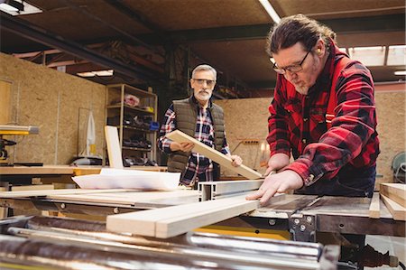 Duo of carpenter working in their workshop Stock Photo - Premium Royalty-Free, Code: 6109-08689725
