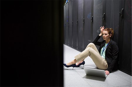 simsearch:6109-08203934,k - Technician feeling the pressure in server room Stock Photo - Premium Royalty-Free, Code: 6109-08690078