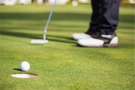 Close up of a golf ball and club on field Photographie de stock - Premium Libres de Droits, Code: 6109-08690524