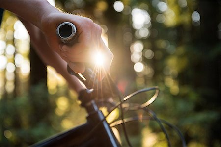 Male athletic standing with mountain bike in park on a sunny day Stock Photo - Premium Royalty-Free, Code: 6109-08764770