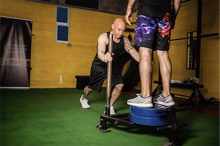 simsearch:649-07238777,k - Thai boxers practicing weight exercise in the fitness studio Stock Photo - Premium Royalty-Free, Code: 6109-08765040