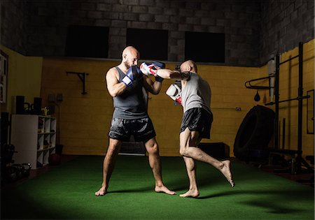simsearch:400-03984387,k - Thai boxers practicing boxing in the fitness studio Stock Photo - Premium Royalty-Free, Code: 6109-08765053