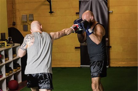 simsearch:649-07238777,k - Thai boxers practicing boxing in the fitness studio Stock Photo - Premium Royalty-Free, Code: 6109-08765051