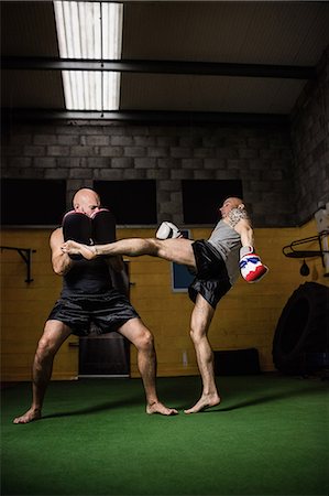 simsearch:400-03984387,k - Thai boxers practicing boxing in the fitness studio Stock Photo - Premium Royalty-Free, Code: 6109-08765068