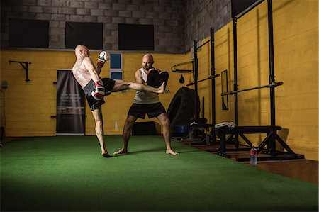 simsearch:649-07238777,k - Thai boxers practicing boxing in the fitness studio Stock Photo - Premium Royalty-Free, Code: 6109-08765035