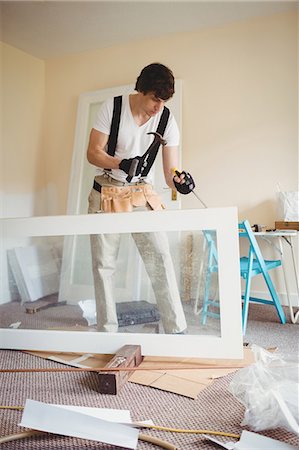 domestic man - Carpenter working on a wooden door at home Stock Photo - Premium Royalty-Free, Code: 6109-08700979