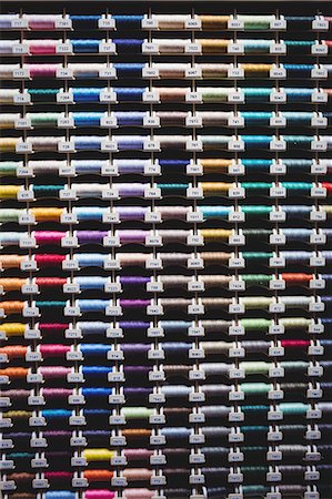 simsearch:6109-08701535,k - Colorful spools of thread in the box Stock Photo - Premium Royalty-Free, Code: 6109-08701538