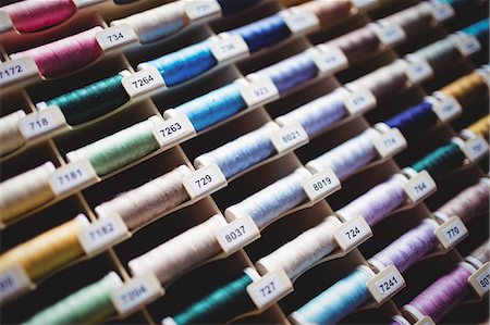 simsearch:6109-08701535,k - Colorful spools of thread in the box Stock Photo - Premium Royalty-Free, Code: 6109-08701539
