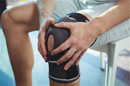 Close-up of man with knee injury in the clinic Stock Photo - Premium Royalty-Free, Code: 6109-08701718