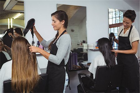 simsearch:6118-08660009,k - Woman getting her hair dried with hair dryer at the hair salon Stock Photo - Premium Royalty-Free, Code: 6109-08705287