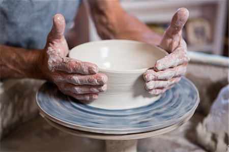 formed - Mid section of potter making pot in pottery shop Stock Photo - Premium Royalty-Free, Code: 6109-08705474