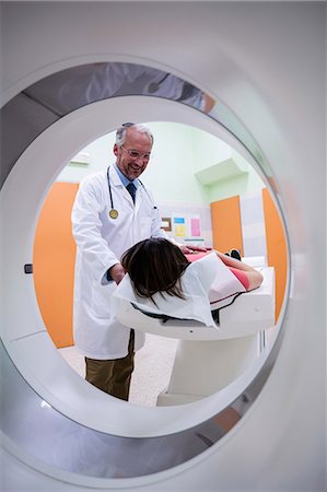 Doctor consoling a patient before an mri scan at hospital Stock Photo - Premium Royalty-Free, Code: 6109-08720108