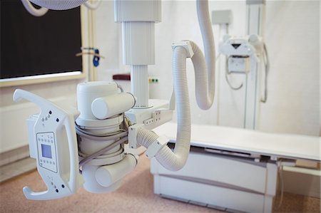 X-ray machine in an empty room at the hospital Stock Photo - Premium Royalty-Free, Code: 6109-08720362