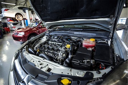 Close-up of car bonnet at repair garage Stock Photo - Premium Royalty-Free, Code: 6109-08722474