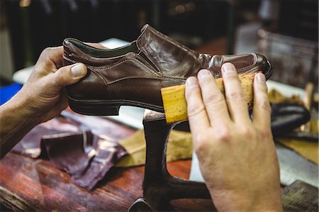 simsearch:400-07899762,k - Shoemaker polishing a shoe in workshop Stock Photo - Premium Royalty-Free, Code: 6109-08722966