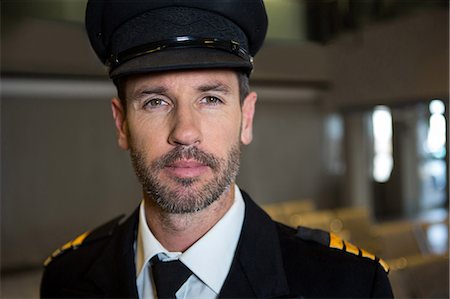 servicing a plane - Portrait of pilot at the airport terminal Stock Photo - Premium Royalty-Free, Code: 6109-08802705