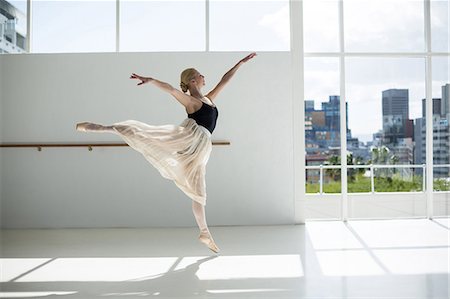 simsearch:400-07725556,k - Ballerina practicing a ballet dance in ballet studio Stock Photo - Premium Royalty-Free, Code: 6109-08803030