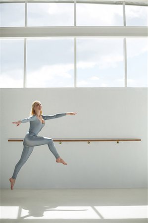 simsearch:400-07725556,k - Ballerina practicing a ballet dance in ballet studio Stock Photo - Premium Royalty-Free, Code: 6109-08803039