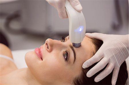 simsearch:6109-08804015,k - Female patient receiving cosmetic treatment at clinic Stock Photo - Premium Royalty-Free, Code: 6109-08803843