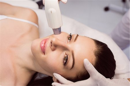 simsearch:6109-08804015,k - Female patient receiving cosmetic treatment at clinic Stock Photo - Premium Royalty-Free, Code: 6109-08803841